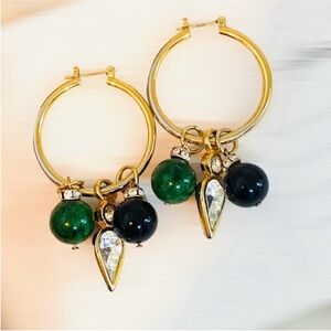 Gold hoop earrings with 3 different charms of crystal onyx and cabochon